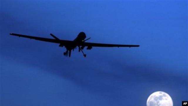 A U.S. Predator drone flies over the moon above Kandahar Air Field, southern Afghanistan (File Photo)