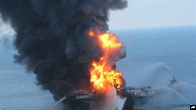 This US Coast Guard image released on April 22, 2010 shows fire boat response crews as they battle the blazing remnants of the off shore oil rig Deepwater Horizon, 21 April 2010.