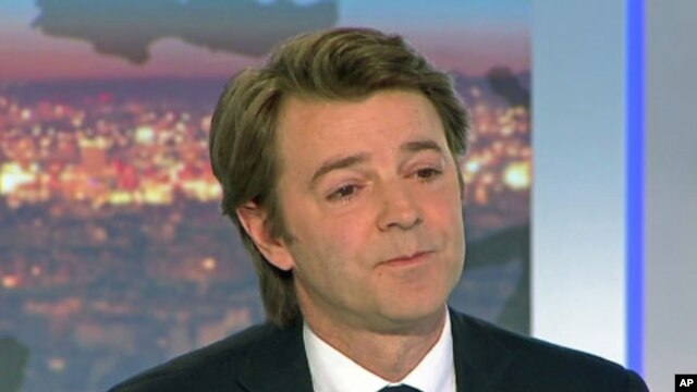 France's Finance and Economy Minister Francois Baroin is seen in this still image taken from video as he speaks on national TV after the  downgrade of France's AAA rating, in Paris, January 13, 2012.