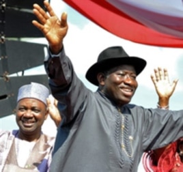 Nigerian President Goodluck Jonathan waves to the crowd before their campaign declaration in Abuja on September 18, 2010.