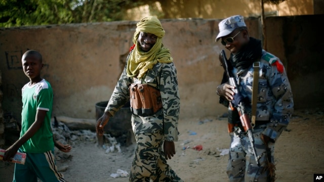 Malian soldiers patrol the streets of Gao, northern Mali, February 5, 2013. 