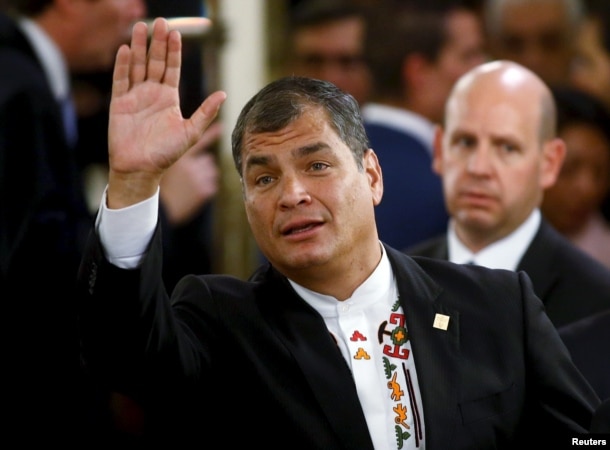 FILE - Ecuador's President Rafael Correa waves prior to a governmental ceremony in Buenos Aires, Argentina, Dec. 10, 2015. Correa recently expressed admiration for Hillary Clinton and said he hoped she wins the U.S. presidential election.