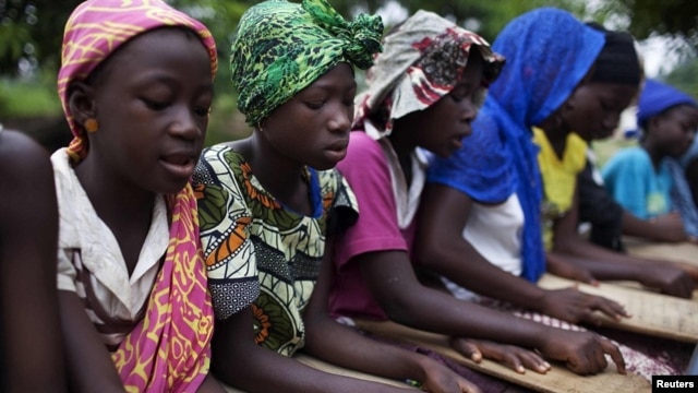 Pupils attend a koranic school in the town of Small Sefoda in eastern Sierra Leone, April 22, 2012.