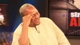 Ghana's Vice President John Dramani Mahama shares a laugh during the interview