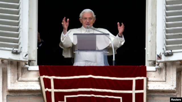 Pope Benedict waves as he leads his last Sunday prayers at the Vatican on February 24, 2013.