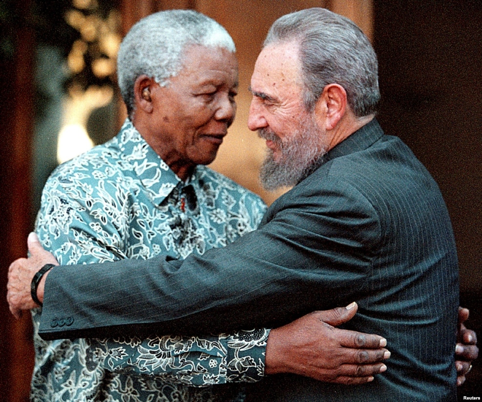 FILE - Former South African President Nelson Mandela (L) hugs Cuba's President Fidel Castro during a visit to Mandela's home in Houghton, Johannesburg, Sept. 2, 2001.