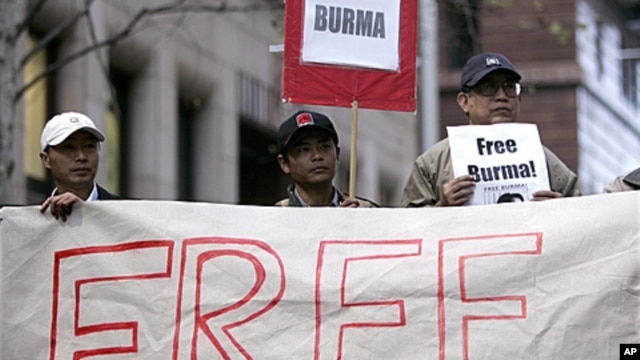 Activists hold "Free Burma" placards at a protest in Sydney in support of  marches in Rangoon by Buddhist monks, (File).