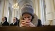 A Russian woman prays inside a Catholic Church in Presnya. (file)
