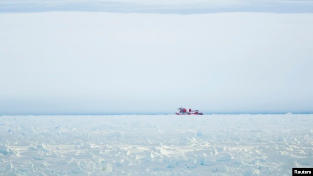 The Xue Long (Snow Dragon) Chinese icebreaker sits in the ice pack unable to get through to the MV Akademik Shokalskiy, in East Antarctica, Dec. 28, 2013.