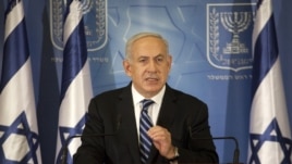 Israel's Prime Minister Benjamin Netanyahu gestures as he delivers a statement to the foreign media in Tel Aviv, November 15, 2012.