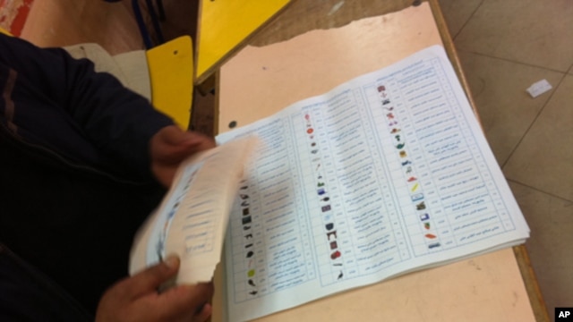 Ballots are readied on the second day of voting in Egypt's landmark parliamentary elections. Symbols make it easier for voters to recognize candidates, November 28, 2011 (file photo).