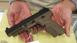 A Belgian-made FN semi-automatic pistol, that can only be purchased in California by law enforcement officers, is displayed for a photo at TDS Guns in Rocklin, California, Nov. 8, 2011.