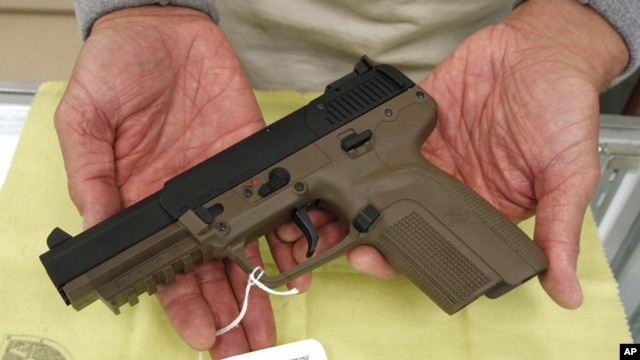 A Belgian-made FN semi-automatic pistol, that can only be purchased in California by law enforcement officers, is displayed for a photo at TDS Guns in Rocklin, California, Nov. 8, 2011.