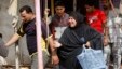 Civilians react at the site of a car bomb attack in front of a crowded popular restaurant in Basra, Iraq, May 20, 2013.