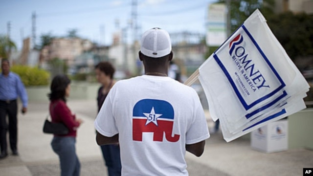 A man wears a shirt in support of Puerto Rican statehood before a campaign stop by Republican presidential candidate, former Massachusetts governor Mitt Romney on Saturday, March 17, 2012, in Bayamon, Puerto Rico.