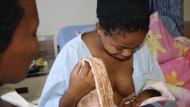 Community health worker Ncedisa Paul (left) counsels a young mother who’s just given birth in a hospital near Zidindi, South Africa (Photos D.Taylor)     
