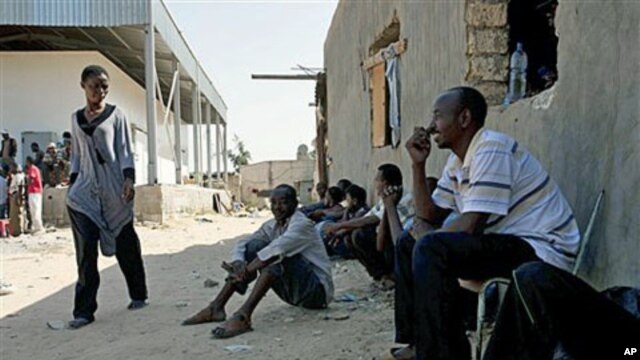 African migrant workers are seen at a farm where they had been hiding from rebel forces in Tripoli, Libya, August 28, 2011.