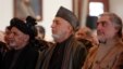 Afghan President Ashraf Ghani, left, former President Hamid Karzai, center, and Chief Executive Abdullah Abdullah, right, attend a ceremony marking the completion of security transition to Afghan security forces in Kabul, Jan. 1, 2015.  