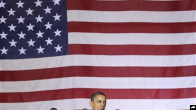 President Barack Obama speaks to troops at a rally during an unannounced visit at Bagram Air Field in Afghanistan, Dec. 3, 2010