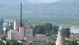 A North Korean nuclear plant is seen before demolishing a cooling tower (R) in Yongbyon, in this photo taken June 27, 2008 and released by Kyodo.