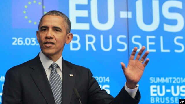 US President Barack Obama addresses the media at the European Council building in Brussels, March 26, 2014. 
