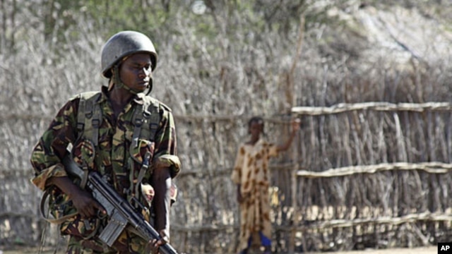 A Kenyan soldier stands guard an airstrip in an area near the Somali-Kenyan border where al-Shabab militants are active (file photo).
