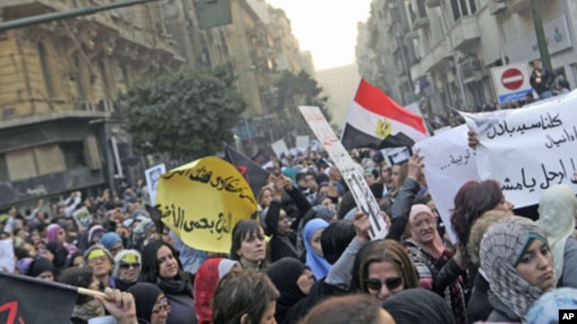 Women chant anti-military council slogans as they protest against the military council violations against female demonstrators in Cairo, Egypt, December 20, 2011.
