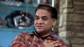 Ông Ilham Tohti, học giả người Uighur bị tuyên án tù chung thân vì đã bày tỏ các quan điểm về Tân Cương