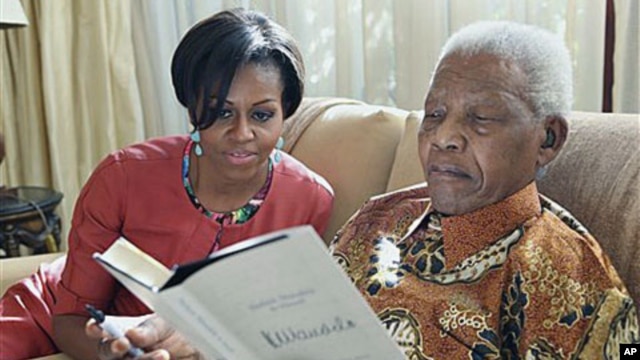 US First Lady Michelle Obama with former South African President Nelson Mandela at this home, in Houghton, South Africa, June 21, 2011. Before becoming president, Mandela was a key ANC leader for many years. (AP Photo/ Debbie Yazbek, Nelson Mandela Founda