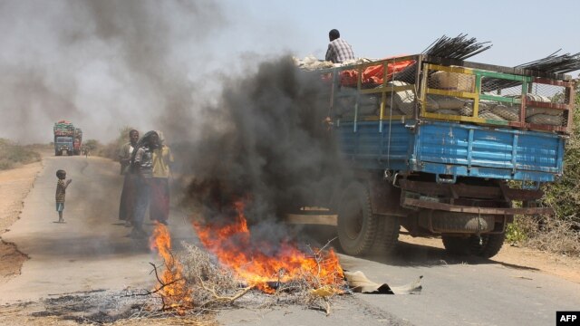 A truck passing a partial roadblock setup by residents as a protest against the Islamist Al-Shabab insurgent group, in Tobanka Buundo in the lower Shabelle region, near the Somalian capital Mogadishu, March 6, 2014.