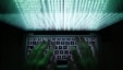 FILE - A man types on a computer keyboard, February 28, 2013. One of the largest ever cyber attacks is slowing global internet services after an organization blocking "spam" content became a target.