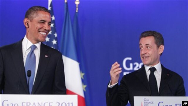 US President Barack Obama, left, and French President Nicolas Sarkozy make statements to reporters after their meeting at G20 Summit in Cannes, November 3, 2011.