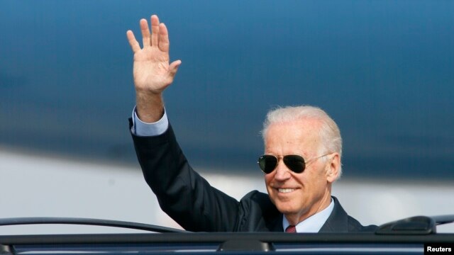U.S. Vice President Joe Biden waves upon his arrival at Boryspil International Airport outside Kyiv April 21, 2014.