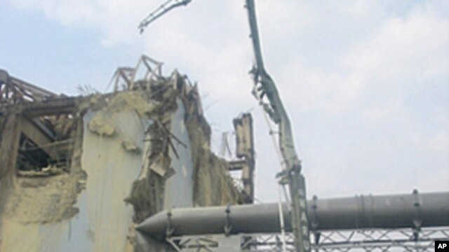 A machine collects radioactive material in the air for sampling at the Unit 3 reactor of Fukushima Daiichi Nuclear Power Station in Fukushima prefecture in this handout picture taken on June 13 and released on June 14, 2011
