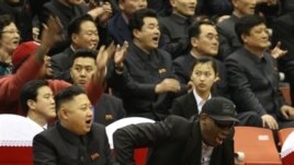 North Korean leader Kim Jong Un, left, and former NBA star Dennis Rodman watch North Korean and U.S. players in an exhibition basketball game, Pyongyang, Feb. 28, 2013.