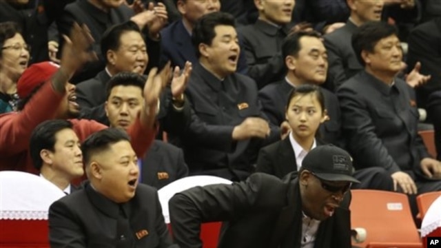North Korean leader Kim Jong Un, left, and former NBA star Dennis Rodman watch North Korean and U.S. players in an exhibition basketball game, Pyongyang, Feb. 28, 2013.