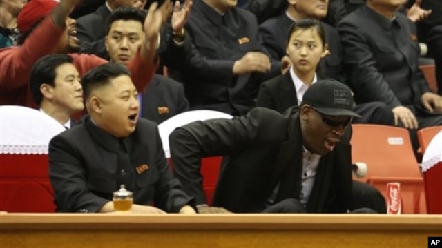 North Korean leader Kim Jong Un, left, and former NBA star Dennis Rodman watch North Korean and U.S. players in an exhibition basketball game, Pyongyang, Feb. 28, 2013.