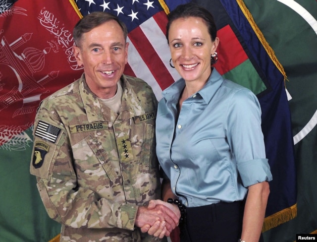 General David Petraeus, former CIA chief and Commander of the International Security Assistance Force/U.S. Forces in Afghanistan, shakes hands with author Paula Broadwell in this handout photo from ISAF, originally posted July 13, 2011.