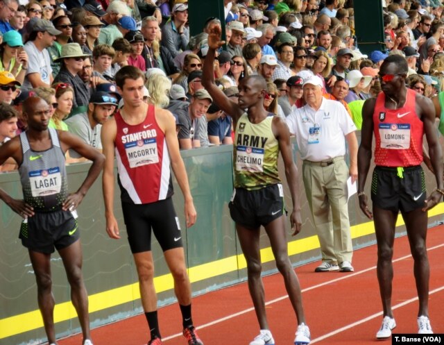 U.S. Army Spc. Paul Chelimo acknowledges the crowd as he is introduced before the 5,000-meter race at the 2016 U.S. Olympic Track and Field Team Trials.
