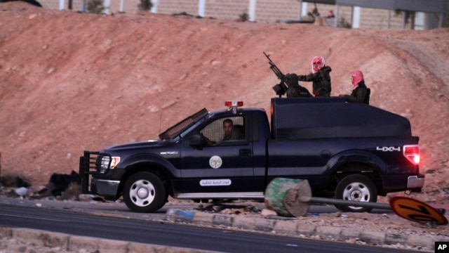 Jordanian security forces leave Swaqa prison, after the executions of Sajida al-Rishawi and Ziad al-Karbouly, two Iraqis linked to al-Qaida, about 50 miles (80 kilometers) south of the Jordan's capital, Amman, Feb. 4, 2015. 