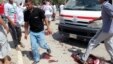 People gather at the site of a bomb attack in Baquba, Iraq, May 17, 2013.