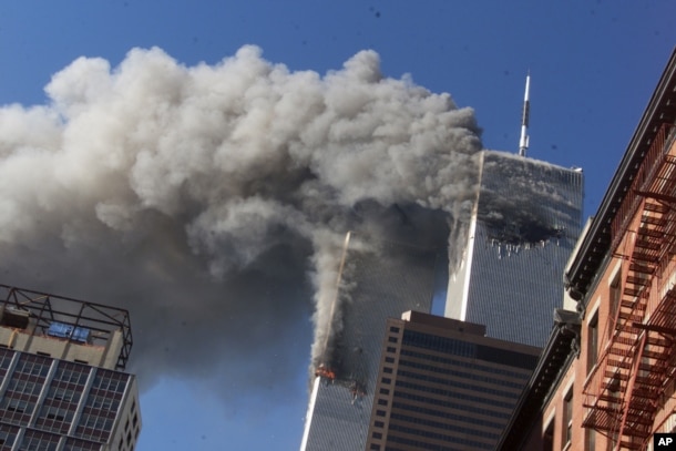 In this Sept. 11, 2001 file photo, smoke rising from the burning twin towers of the World Trade Center after hijacked planes crashed into the towers, in New York City.