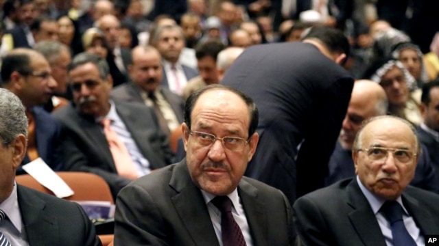 Thủ tướng Iraq Nouri al-Maliki (giữa) dự phiên họp Quốc hội, 1/7/14 