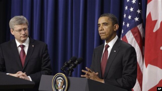 President Barack Obama and Canada's Prime Minister Stephen Harper take part in a joint news conference after their meeting at the White House in Washington, Friday, Feb. 4, 2011