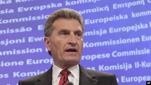 European Commissioner for Energy Guenther Oettinger addresses the media at the European Commission headquarters in Brussels, May 25, 2011