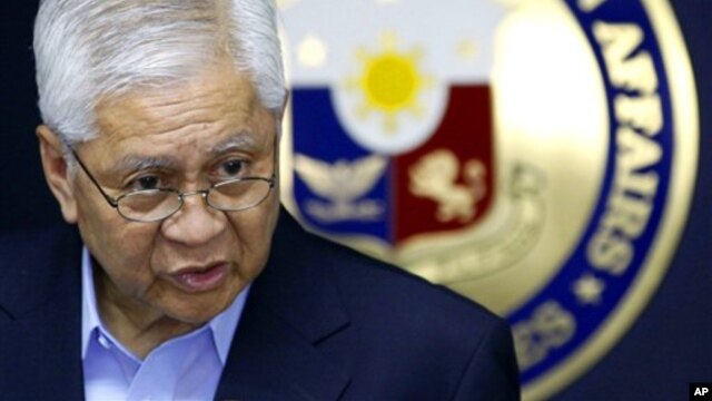 Philippine Foreign Affairs Secretary Albert Del Rosario addresses the media during a press conference in suburban Pasay City, south of Manila, Philippines, after his return from the ASEAN Regional Forum in Cambodia Friday, July 13, 2012. Del Rosario deplo