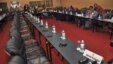 Congolese delegation sits opposite row of empty seats intended for delegation of M23 rebels, Kampala, Uganda, Dec. 10, 2012.