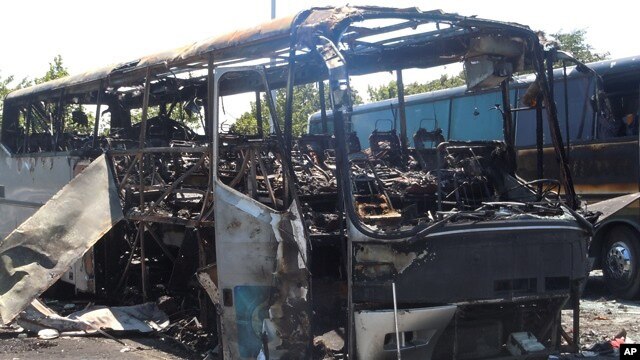 The scene following a deadly suicide attack on a bus full of Israeli vacationers at the Burgas, Bulgaria airport parking lot. After investigation, the Bulgarian government announced Hezbollah was responsible. (file)