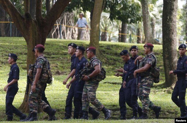 Members of the military and police patrol outside the venue for the 27th Association of Southeast Asian Nations (ASEAN) summit in Kuala Lumpur, Malaysia, Nov. 20, 2015.