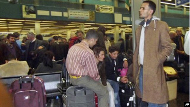 Passengers pack Tripoli's International airport  as they try to catch flights leaving Libya. European countries are sending planes and ferries to Libya to evacuate their citizens, February 22, 2011